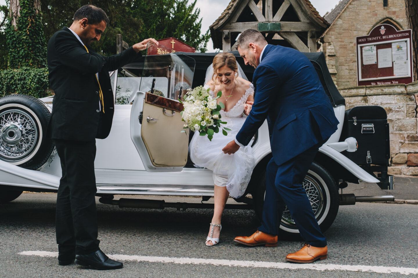 bride arrives at her wedding at belbroughton church